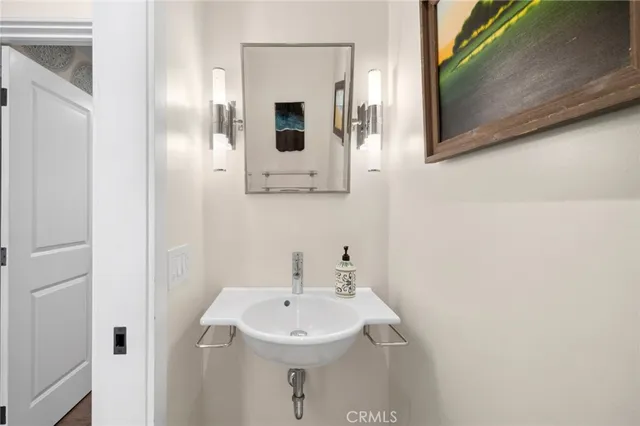 a bathroom with a sink and mirror