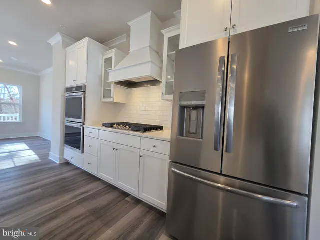 a kitchen with a stove and cabinets