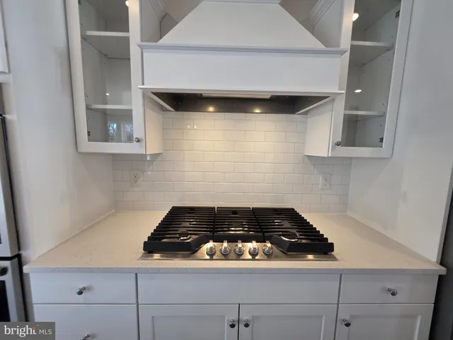 a view of living room with wooden floor and fireplace