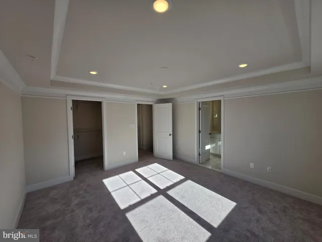 a spacious bathroom with a bathtub shower sink and mirror