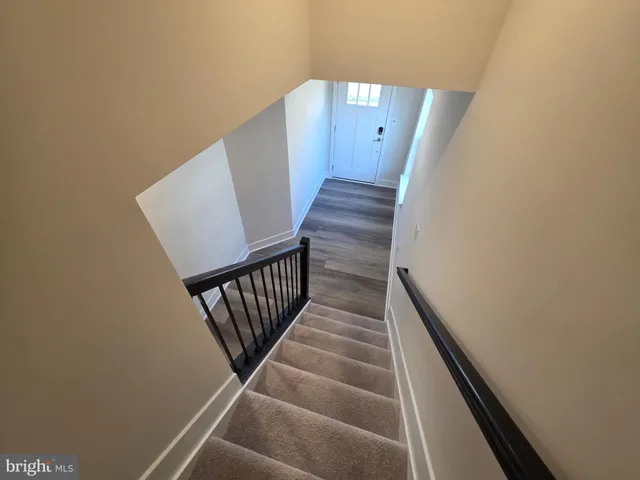a kitchen with stainless steel appliances a refrigerator sink and microwave