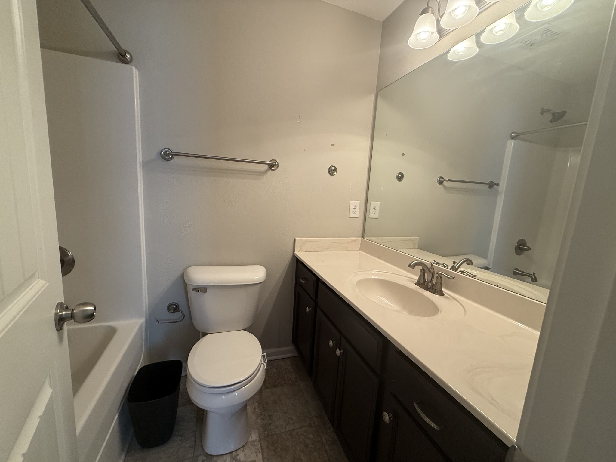 146 Ramsden Avenue La Vergne, TN 37086 - Photo 11 of 11 a bathroom with a sink a toilet a mirror and shower