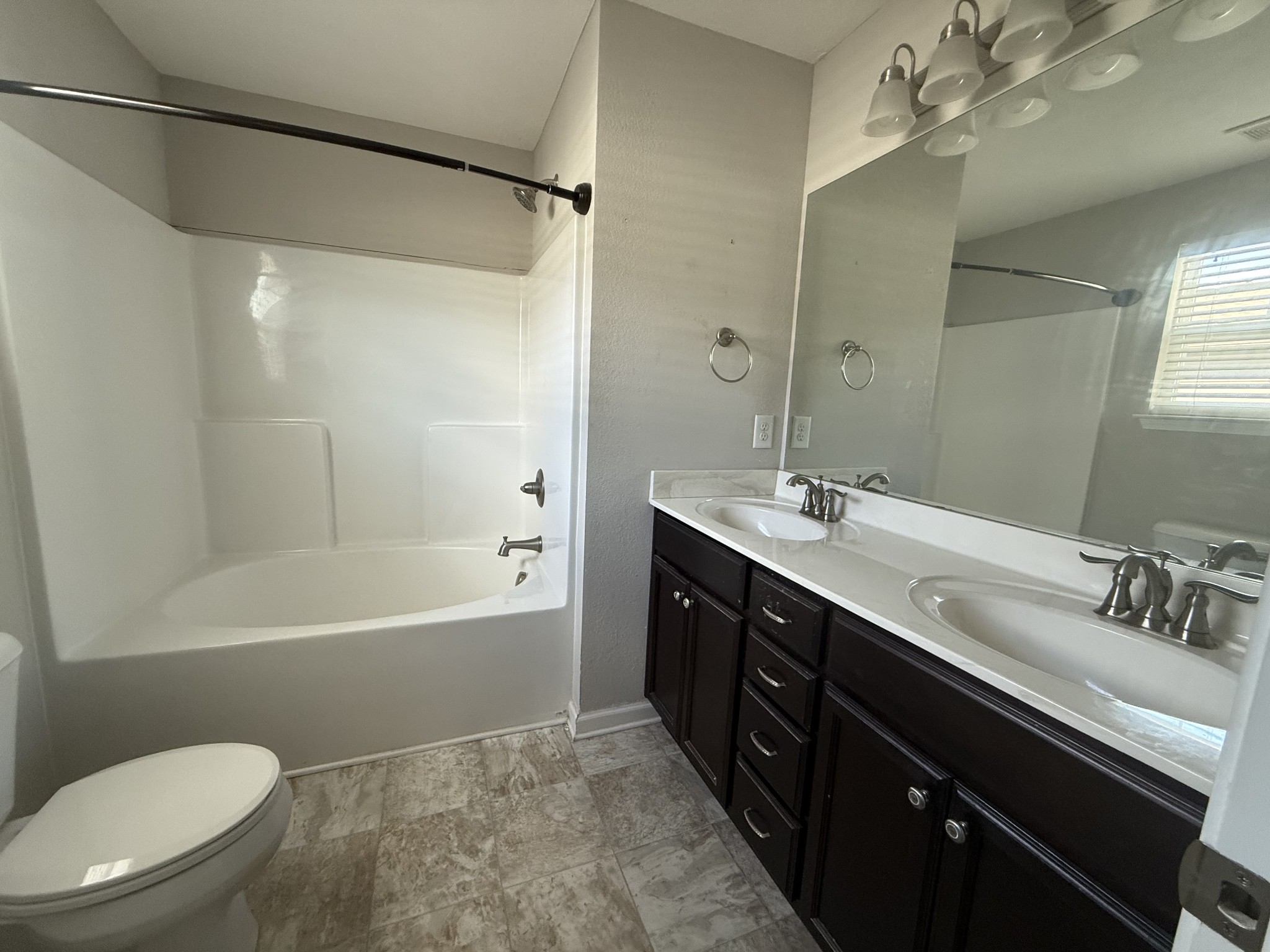 146 Ramsden Avenue La Vergne, TN 37086 - Photo 9 of 11 a bathroom with a double vanity sink mirror and toilet