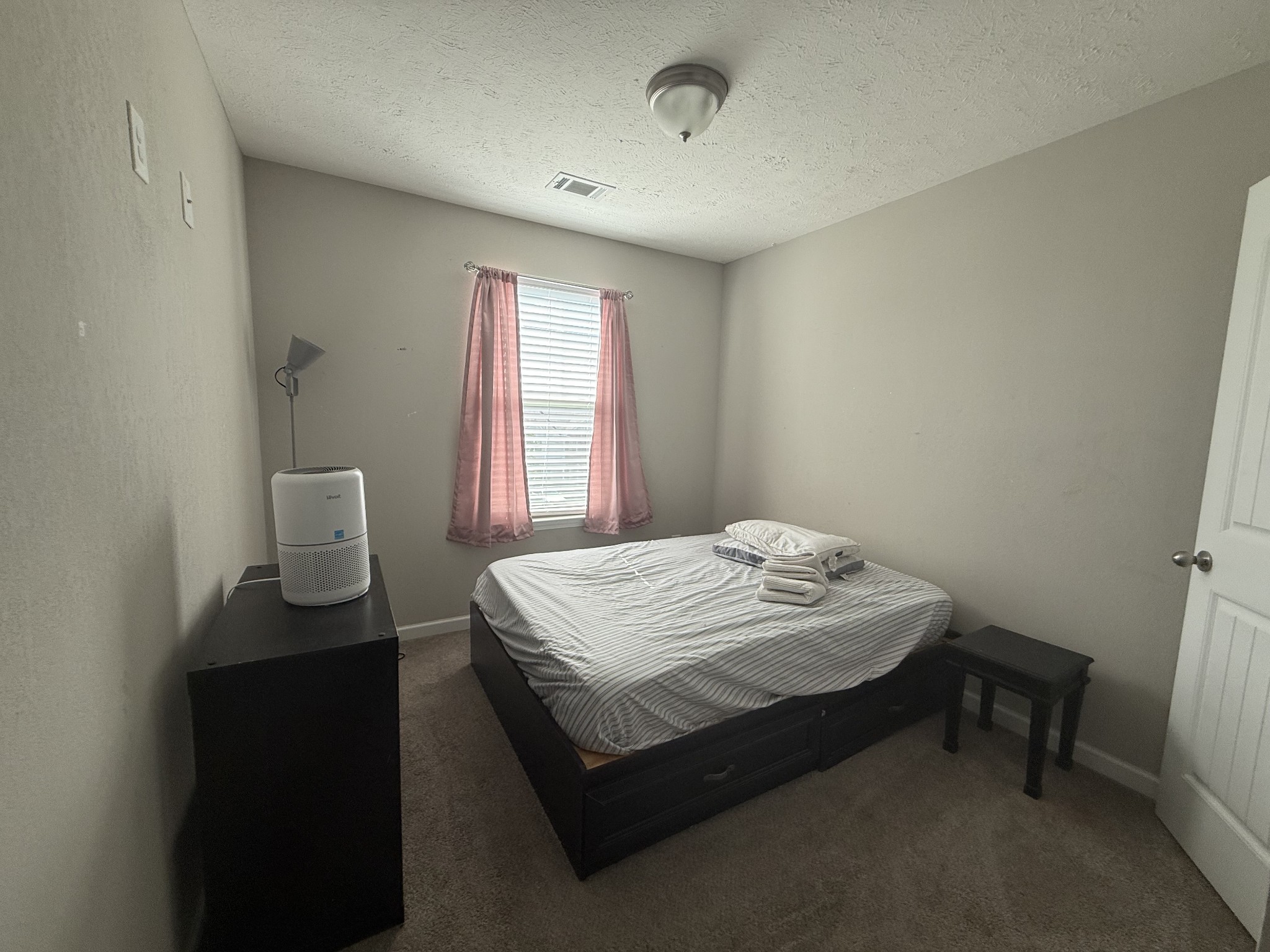 146 Ramsden Avenue La Vergne, TN 37086 - Photo 10 of 11 a bedroom with a bed and a table