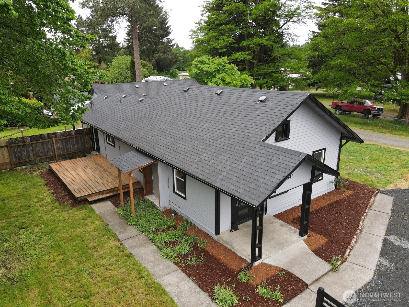 10341 184th Avenue Southwest Rochester, WA 98579 - Photo 17 of 36 a aerial view of a house with a yard table and chairs
