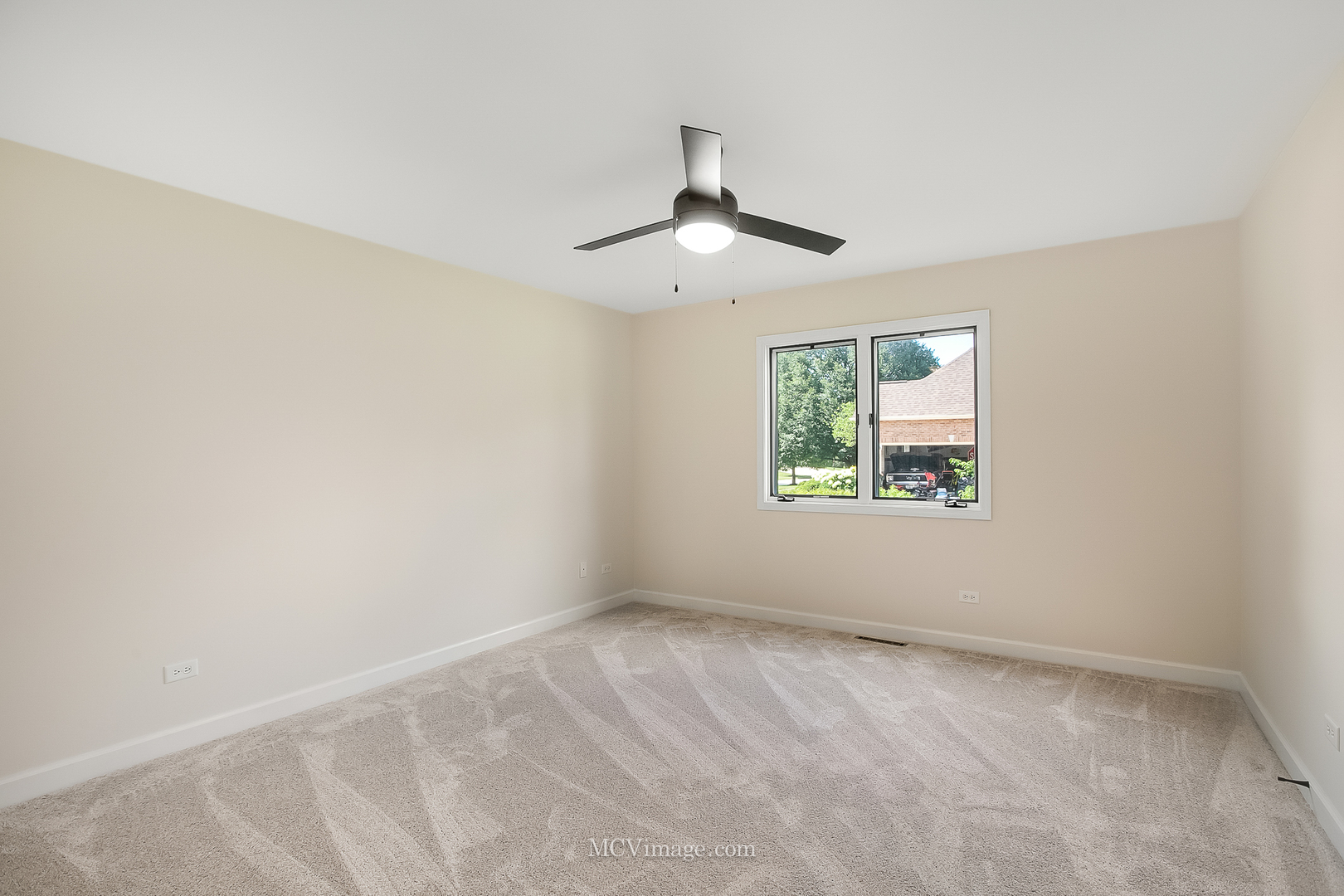 32 Robert Road Oswego, IL 60543 - Photo 15 of 33 an empty room with a window and a ceiling fan