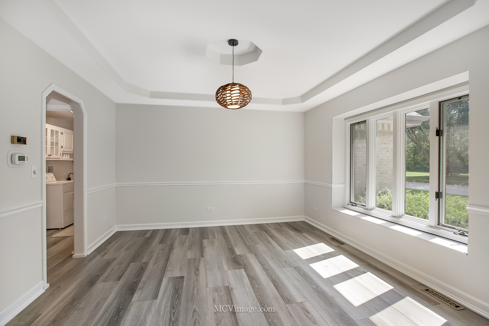 32 Robert Road Oswego, IL 60543 - Photo 4 of 33 wooden floor in an empty room with a window