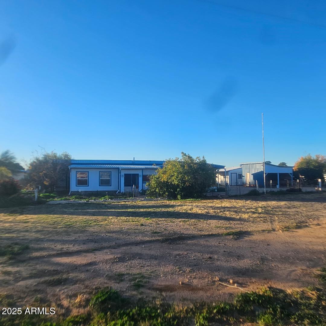 a view of a yard in front of a house