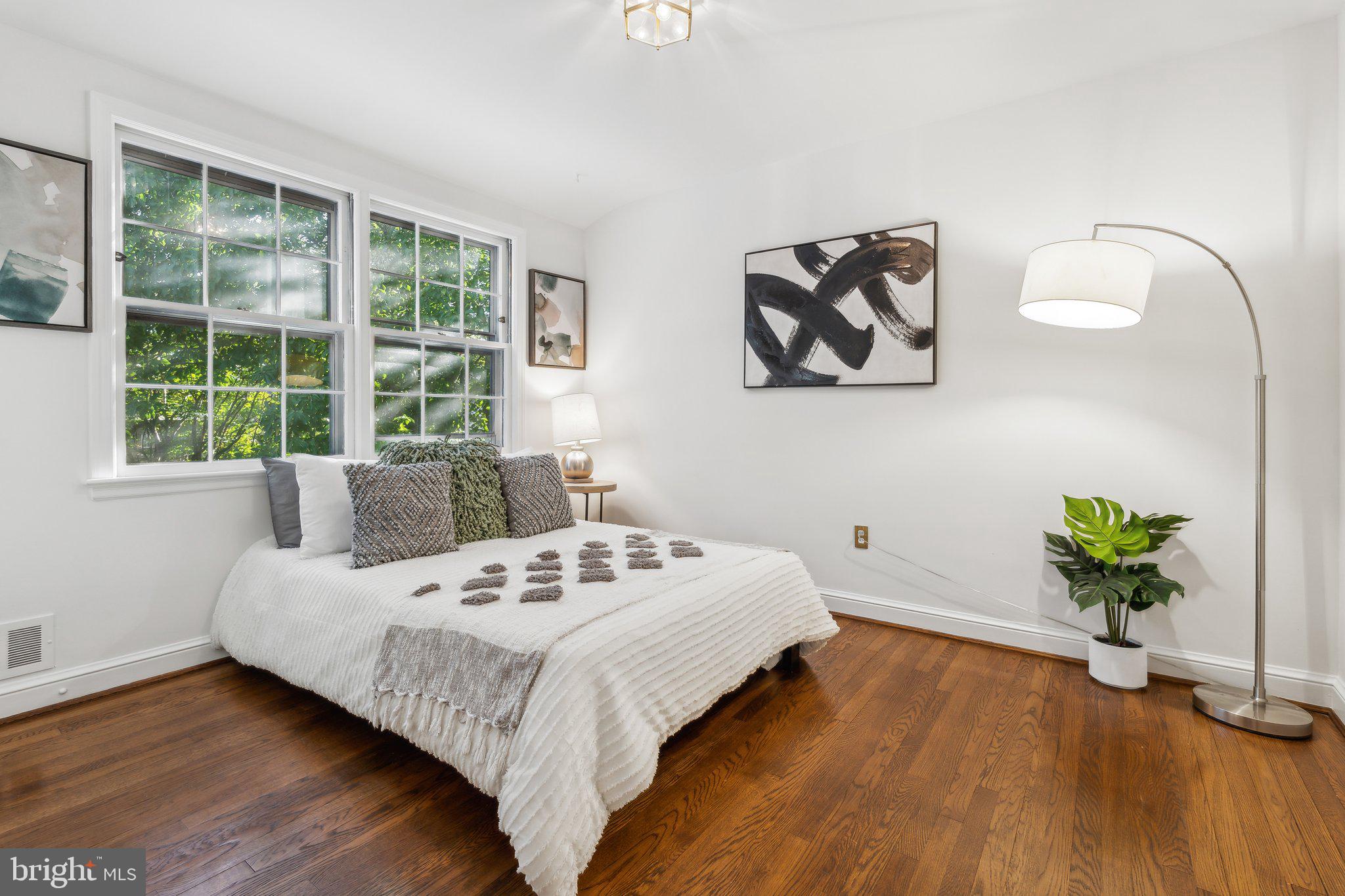 5125 Baltan Road Bethesda, MD 20816 - Photo 23 of 38 a bedroom with a bed and a potted plant