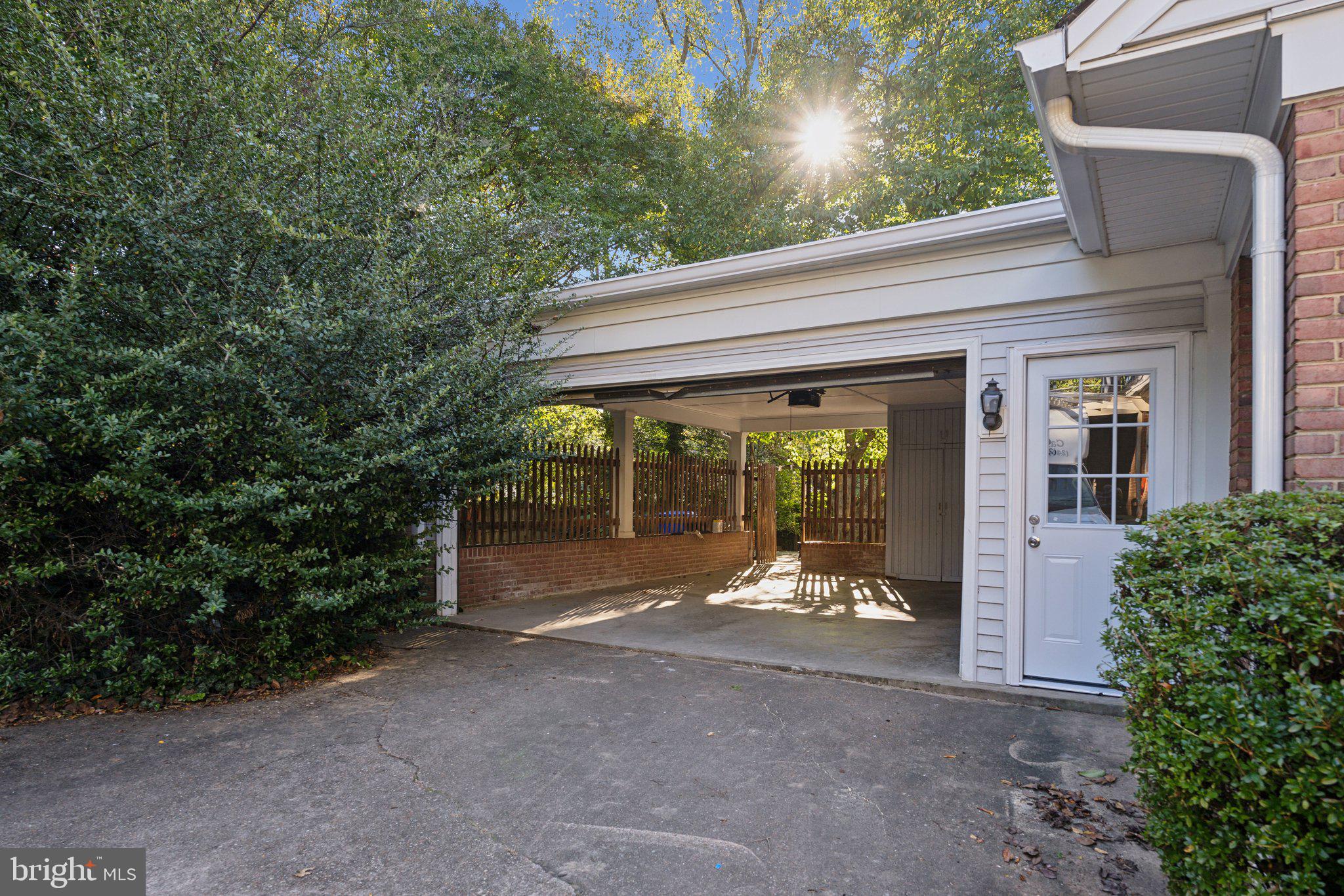 5125 Baltan Road Bethesda, MD 20816 - Photo 35 of 38 a view of a patio with table and chairs and floor to ceiling window