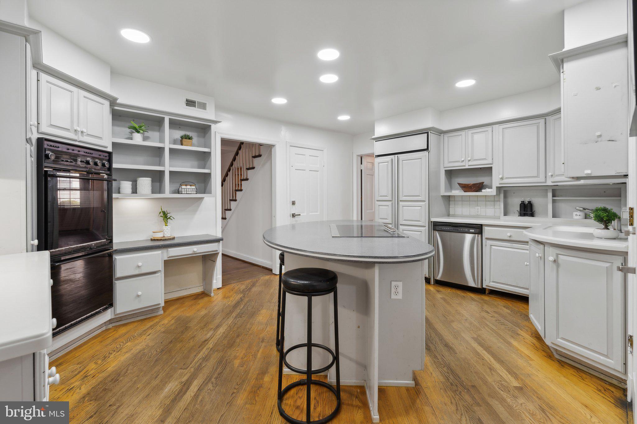 5125 Baltan Road Bethesda, MD 20816 - Photo 8 of 38 a kitchen with kitchen island a counter top space appliances and cabinets