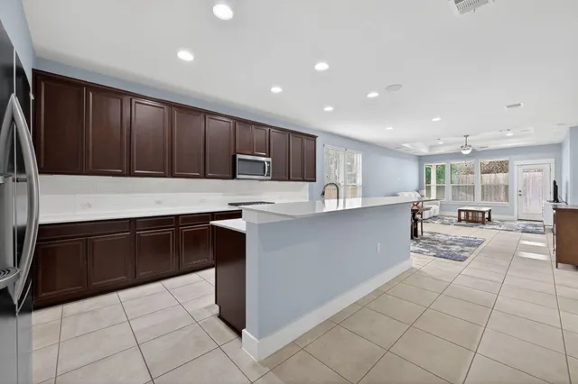 a kitchen with a sink and cabinets