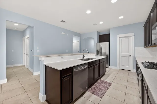 a view of a dining room with furniture and a large window