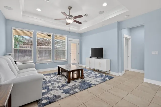 a bedroom with a bed dresser and a window