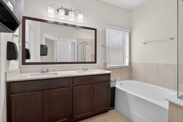 a bathroom with a bathtub and a shower