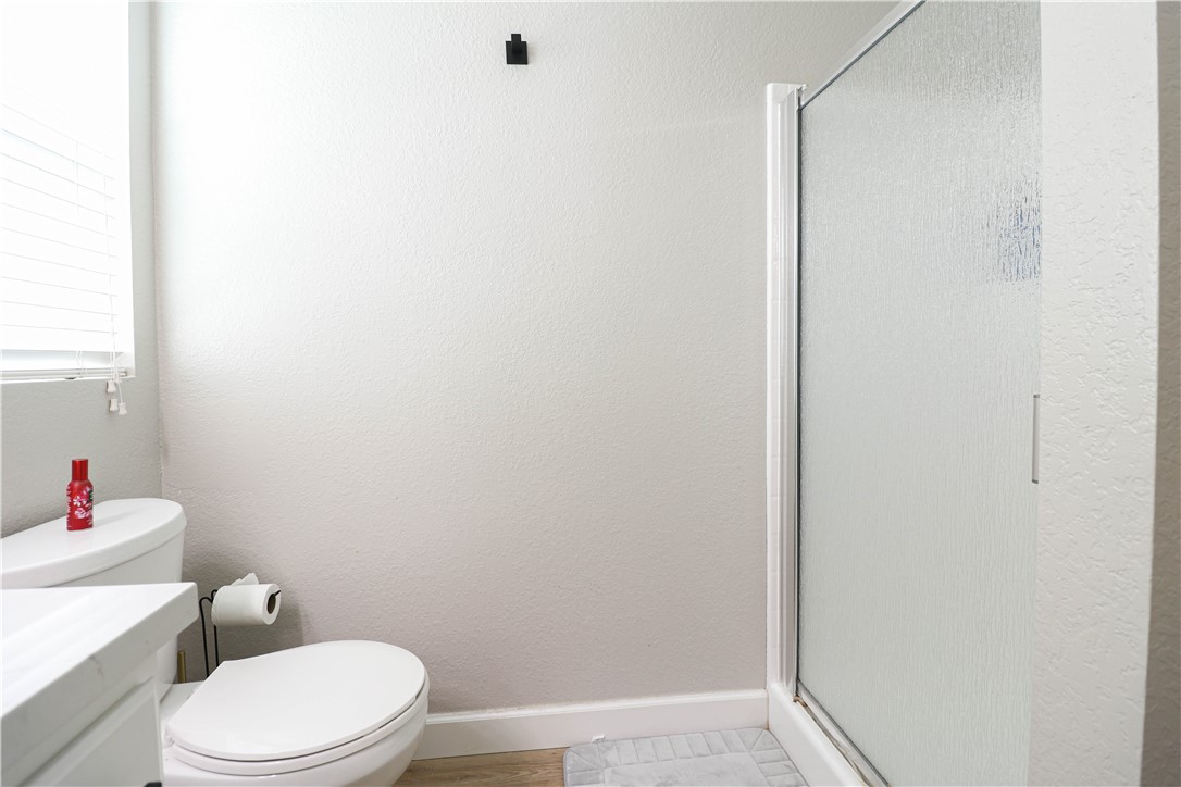 730 Breeze Hill Road, Unit 230 Vista, CA 92081 - Photo 15 of 40 a white toilet sitting next to a white sink and vanity