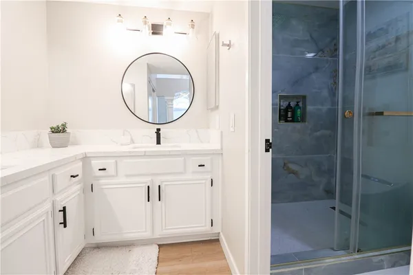 a bathroom with a sink and a mirror