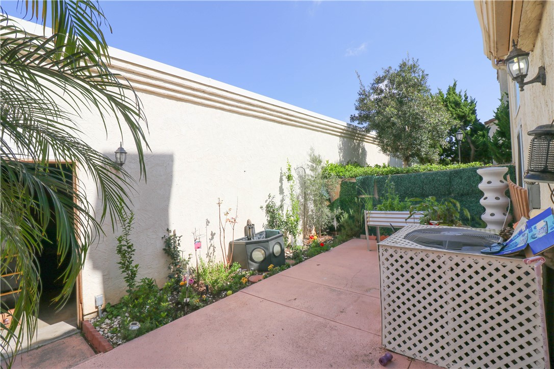 730 Breeze Hill Road, Unit 230 Vista, CA 92081 - Photo 31 of 40 a view of a patio with couches table and chairs and potted plants