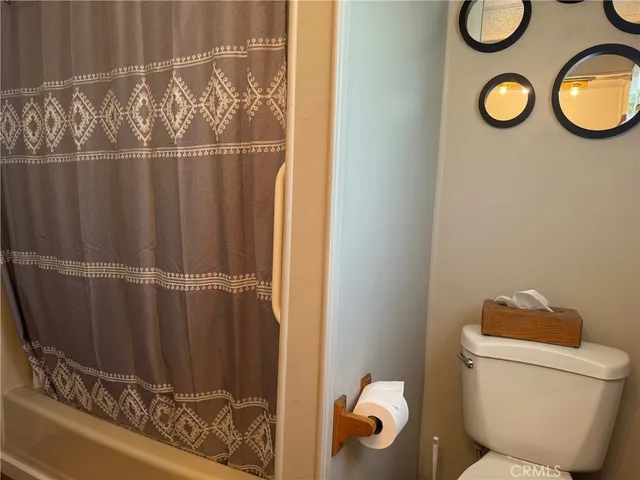a bathroom with a toilet and a sink