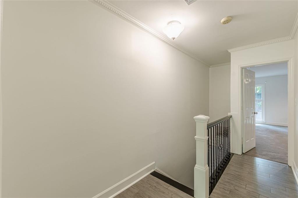 320 Alberta Terrace Northeast, Unit 3 Atlanta, GA 30305 - Photo 41 of 54 a view of a hallway with wooden floor