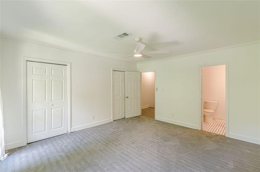 320 Alberta Terrace Northeast, Unit 3 Atlanta, GA 30305 - Photo 44 of 54 an empty room with wooden floor and ceiling fan