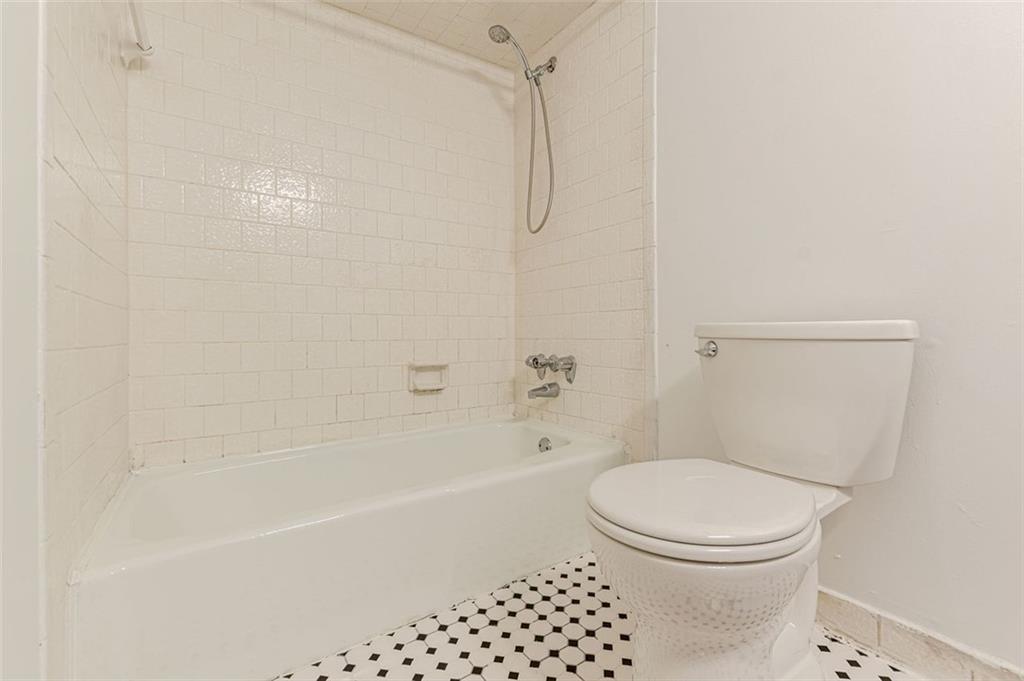 320 Alberta Terrace Northeast, Unit 3 Atlanta, GA 30305 - Photo 47 of 54 a bathroom with a toilet and a shower