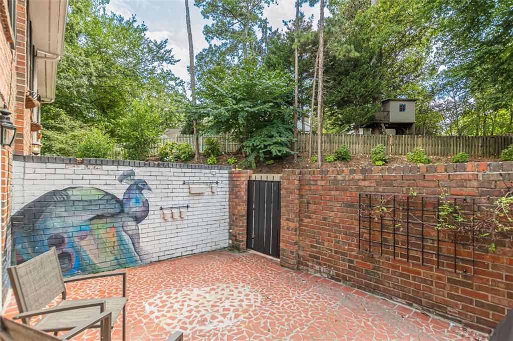 320 Alberta Terrace Northeast, Unit 3 Atlanta, GA 30305 - Photo 8 of 54 a backyard of a house with lots of green space