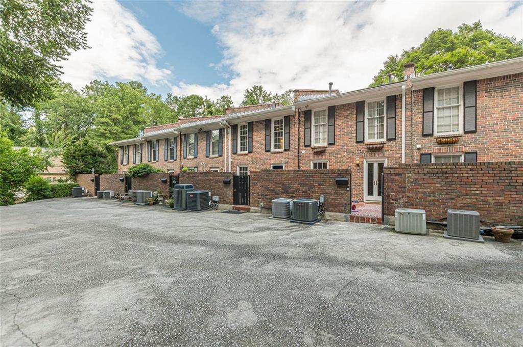 320 Alberta Terrace Northeast, Unit 3 Atlanta, GA 30305 - Photo 9 of 54 a front view of a house with patio