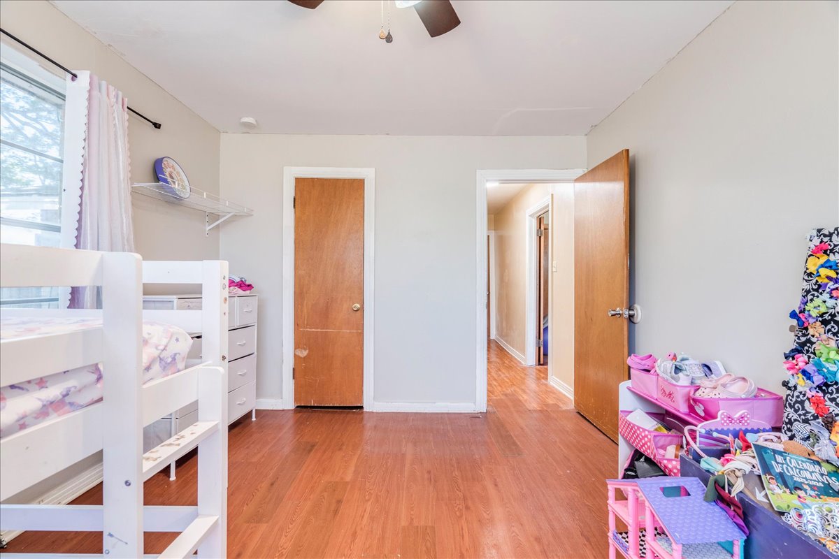 500 Blackjack Street Lockhart, TX 78644 - Photo 18 of 27 Bedroom with light wood-style floors and ceiling fan