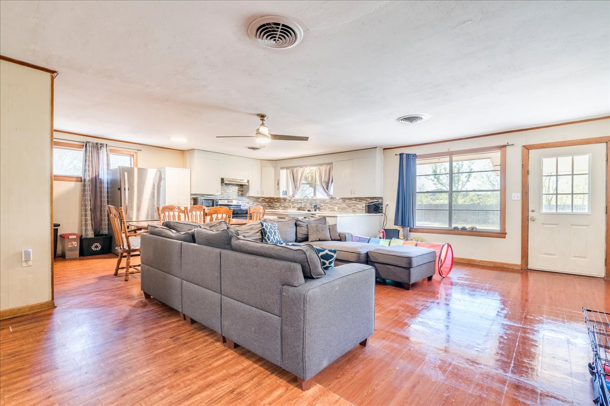 500 Blackjack Street Lockhart, TX 78644 - Photo 7 of 27 Living room with plenty of natural light, light wood-style flooring, and a ceiling fan