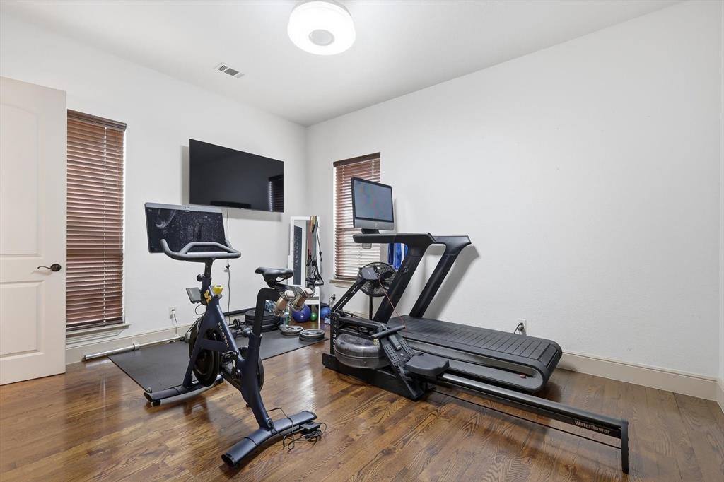 406 Spurgin Road Lucas, TX 75002 - Photo 27 of 39 Workout area featuring wood finished floors and baseboards