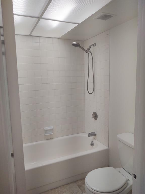 9 Royal Palm Way, Unit 201 Boca Raton, FL 33432 - Photo 12 of 21 a bathroom with a toilet and a bath tub