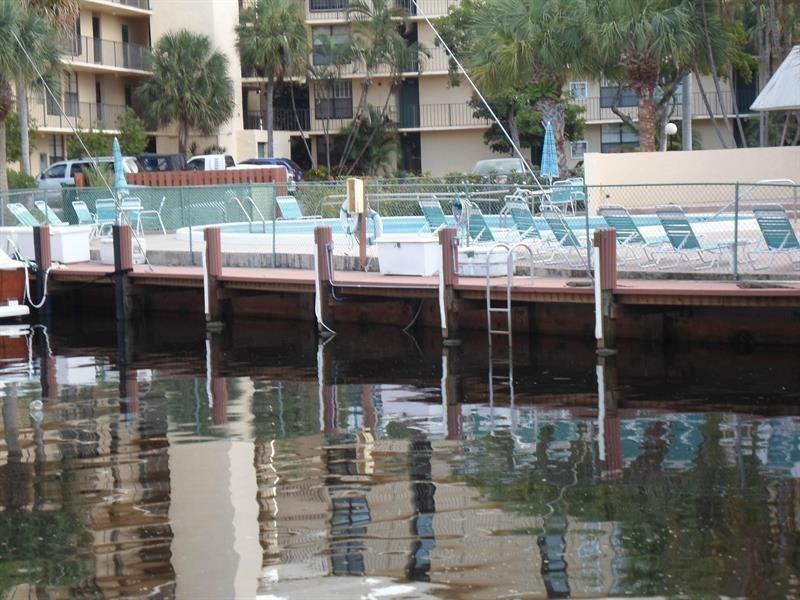 9 Royal Palm Way, Unit 201 Boca Raton, FL 33432 - Photo 18 of 21 a backyard of a house with barbeque oven