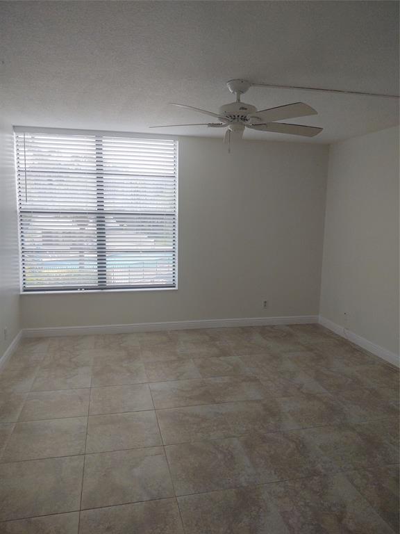 9 Royal Palm Way, Unit 201 Boca Raton, FL 33432 - Photo 8 of 21 a view of an empty room with a window