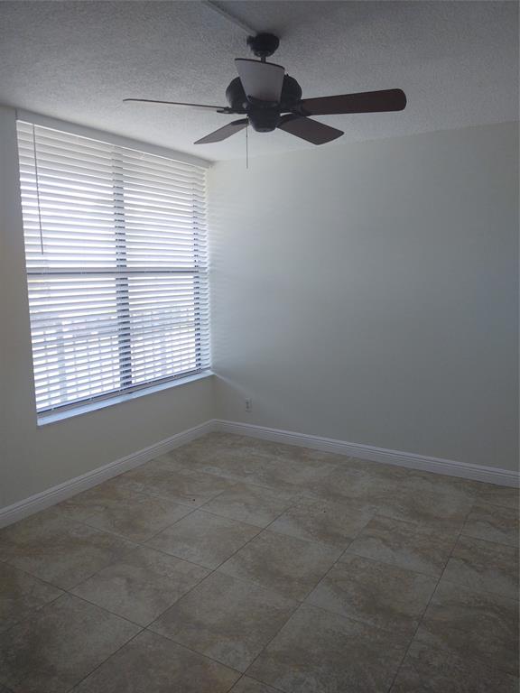 9 Royal Palm Way, Unit 201 Boca Raton, FL 33432 - Photo 9 of 21 a view of an empty room with a window