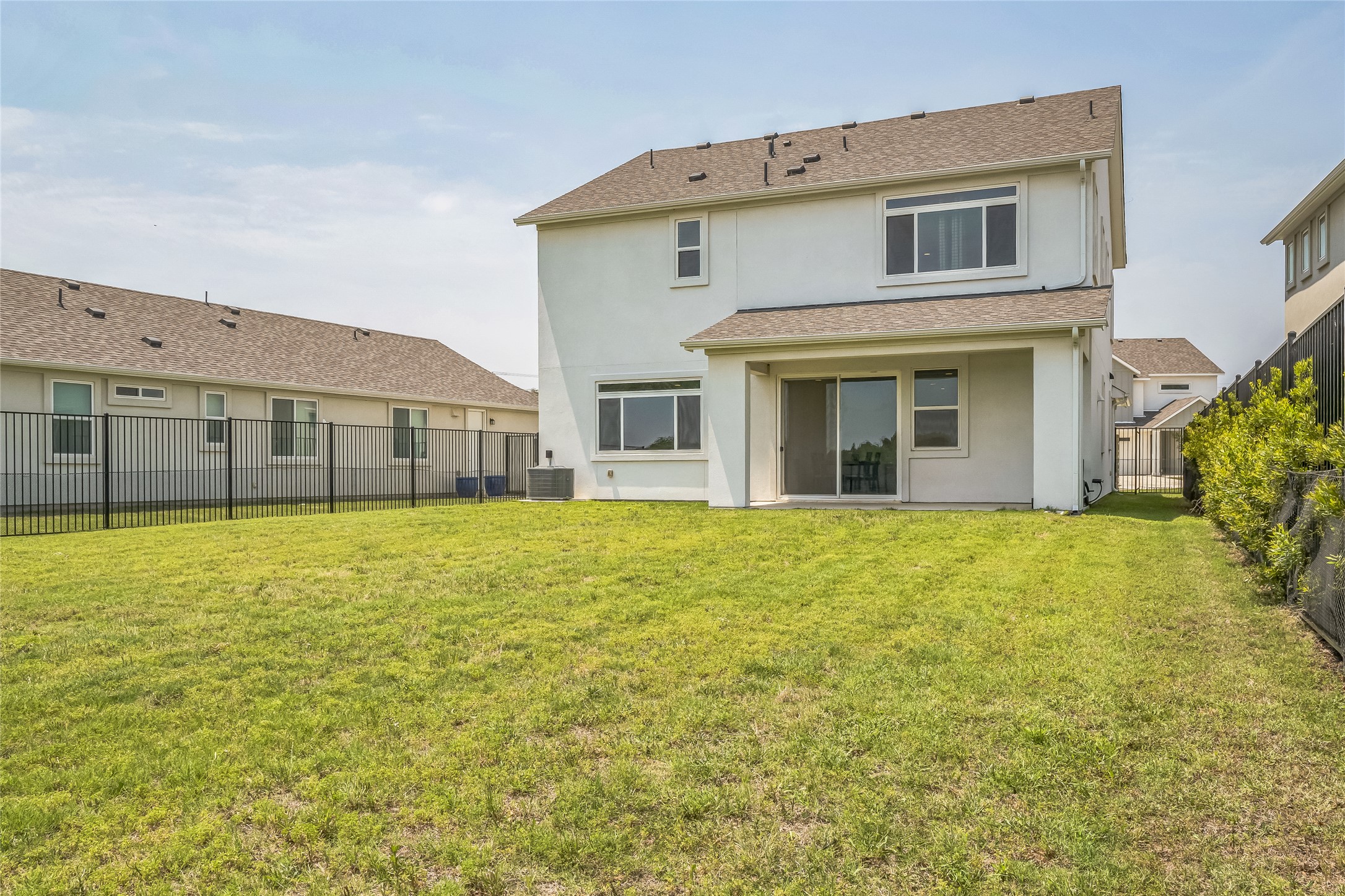 3706 Mesquite Vly Road Georgetown, TX 78628 - Photo 27 of 30 Rear view of house with stucco siding and central AC