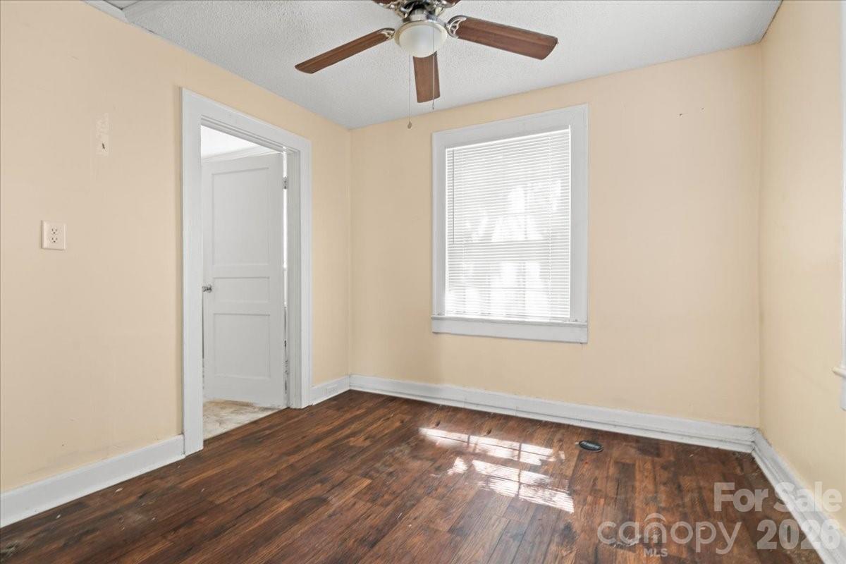 501 Church Street Cheraw, SC 29520 - Photo 23 of 48 wooden floor in an empty room with a window