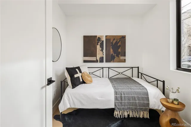 a en suite bathroom with a toilet sink and mirror