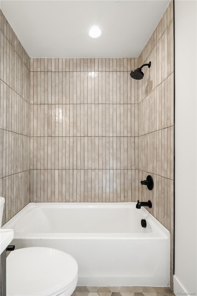 4435 Tennyson Street Denver, CO 80212 - Photo 27 of 30 a bathroom with a bathtub and shower