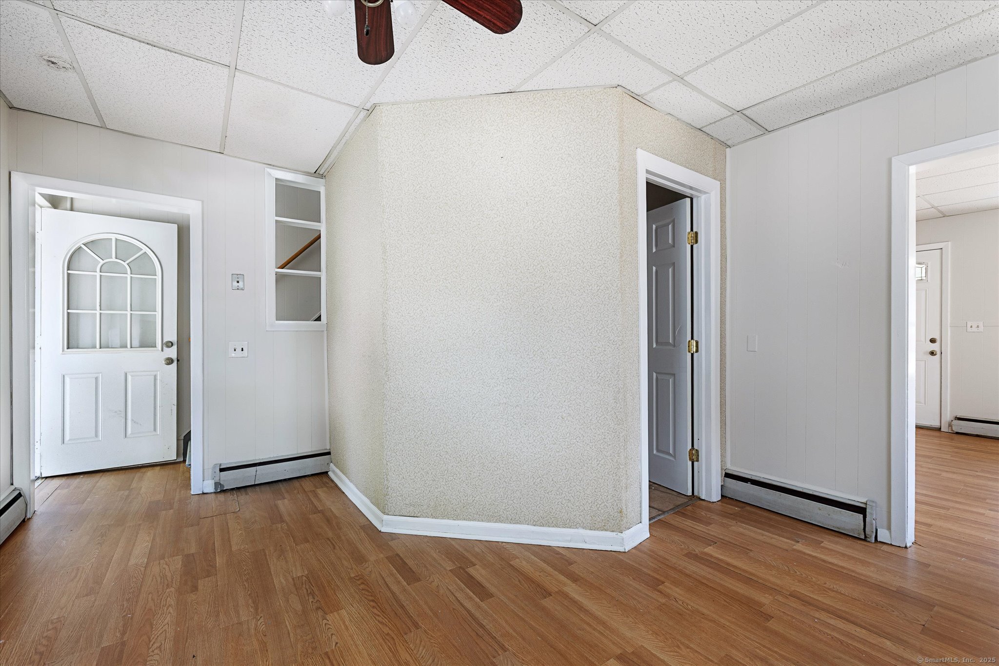 42-44 Church Street Plainfield, CT 06354 - Photo 14 of 36 an empty room with wooden floor and windows