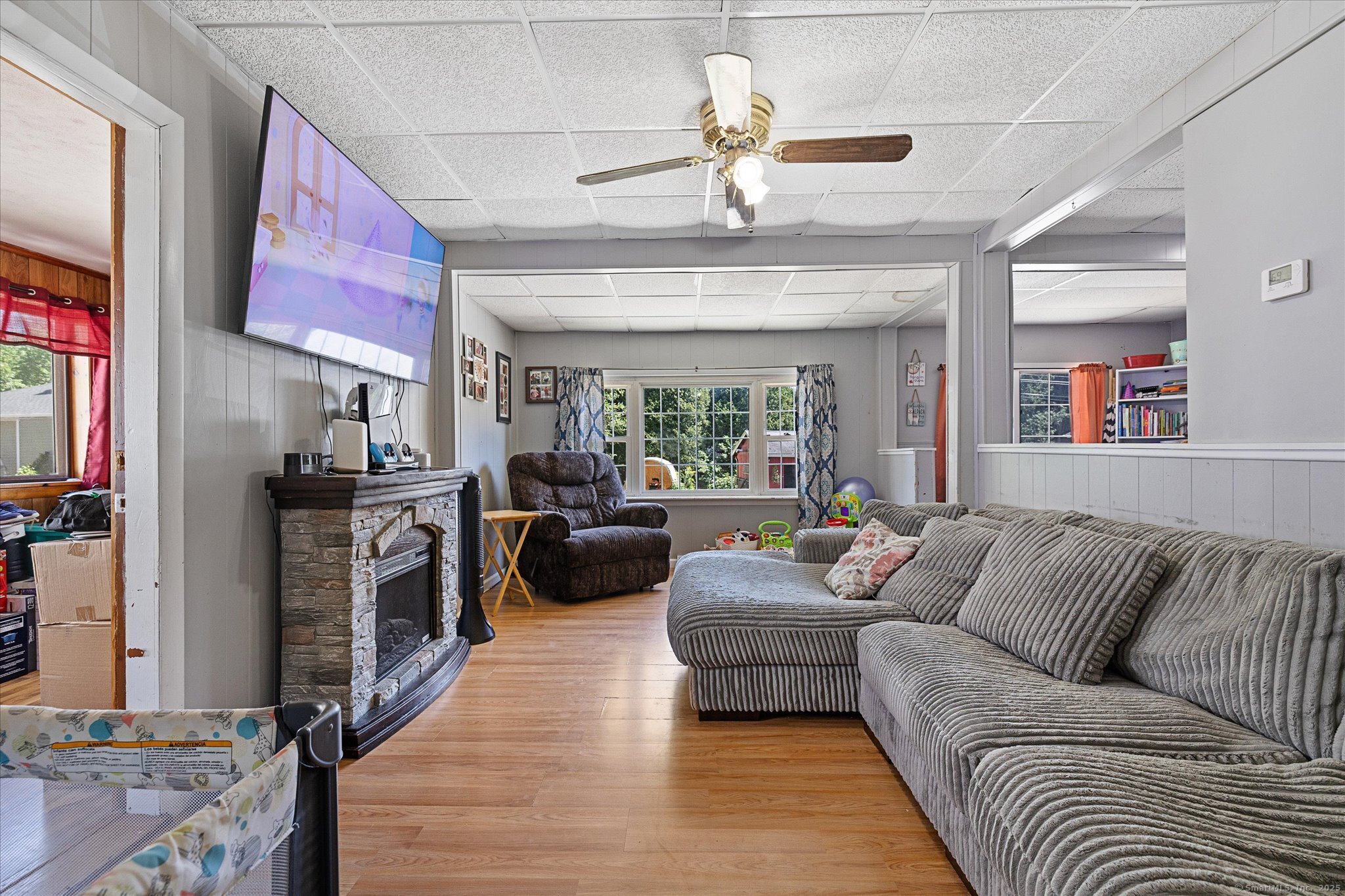 42-44 Church Street Plainfield, CT 06354 - Photo 24 of 36 a living room with furniture ceiling fan and a rug