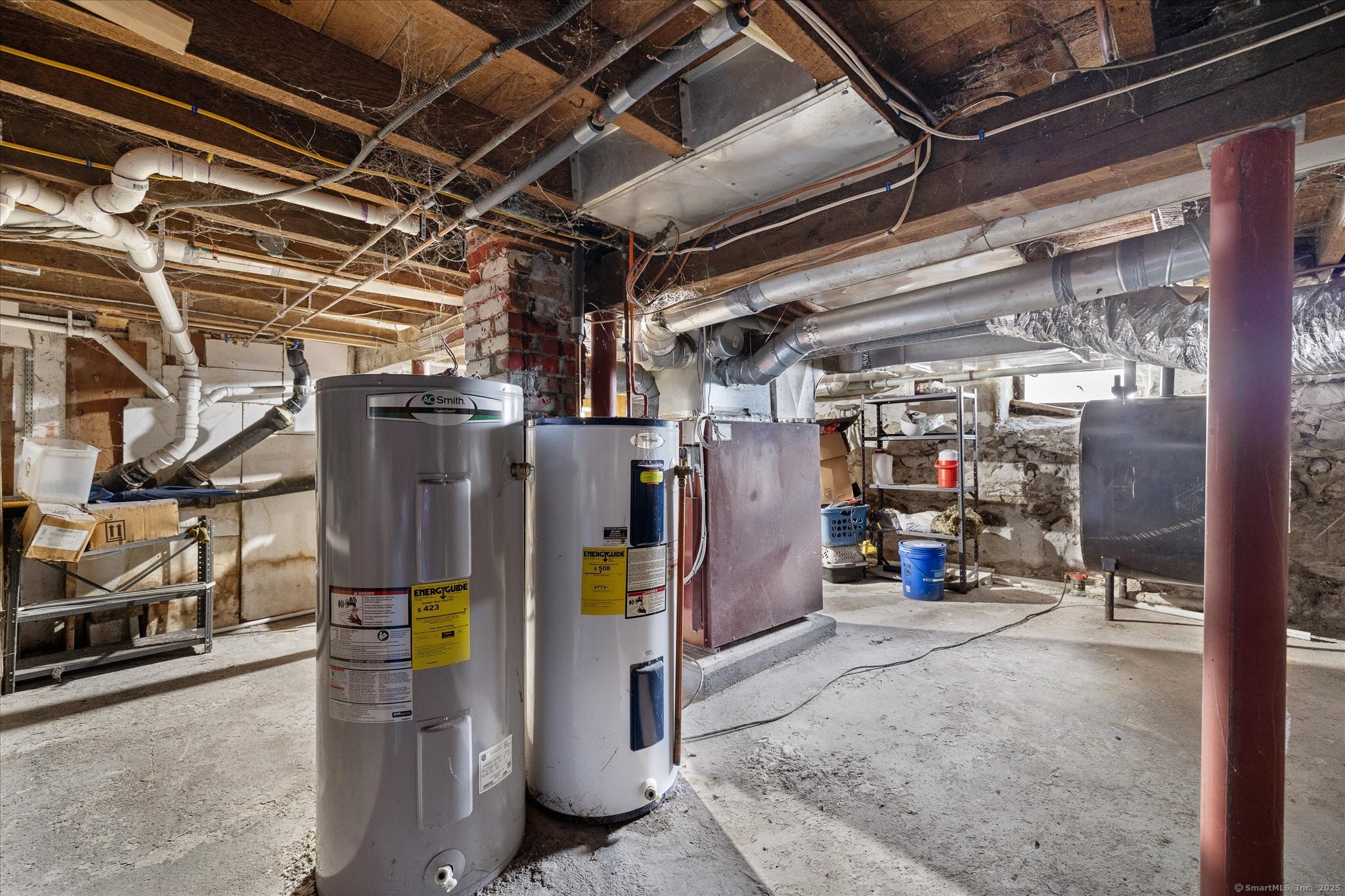 42-44 Church Street Plainfield, CT 06354 - Photo 36 of 36 a view of water heater room with refrigerator