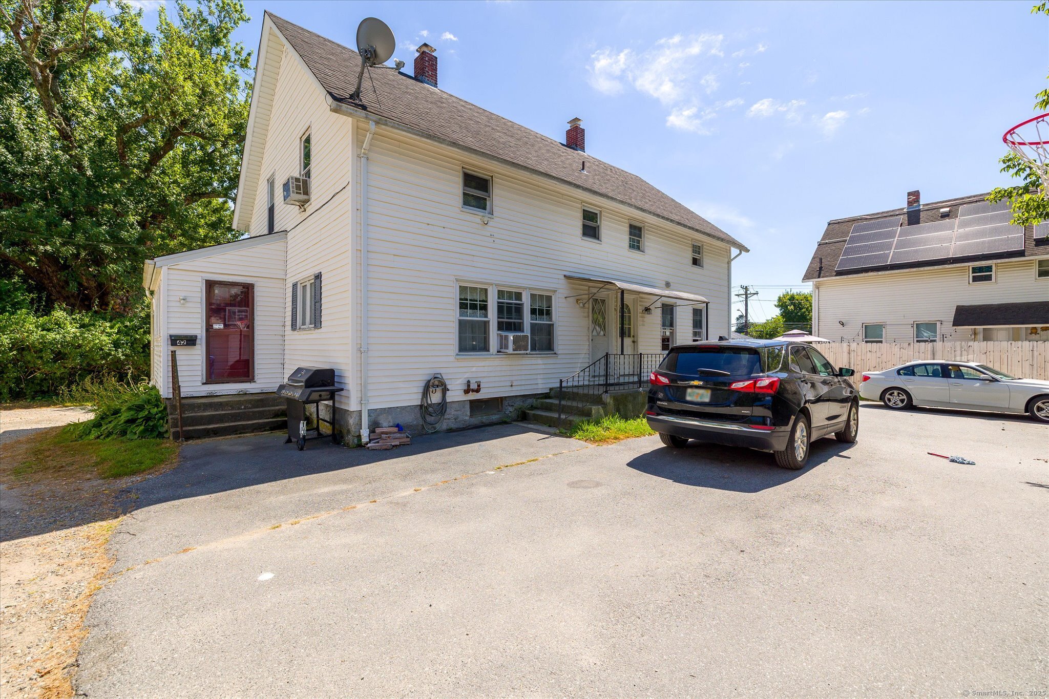 42-44 Church Street Plainfield, CT 06354 - Photo 4 of 36 a view of a house with a patio