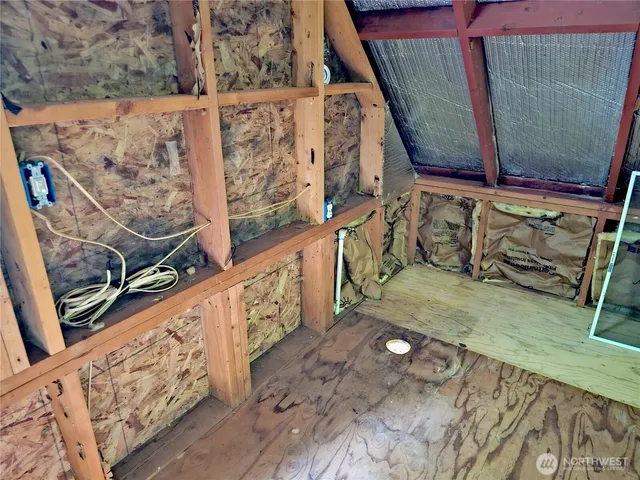 a view of staircase with wooden floor