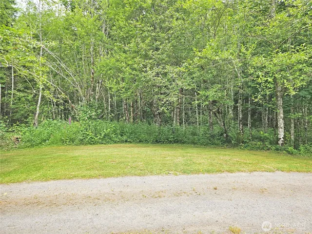 a view of a swimming pool with an outdoor space and seating area