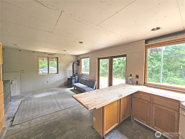 a spacious bedroom with a large bed and a window