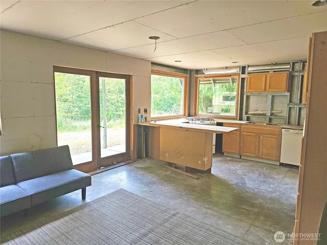 a view of a kitchen with a sink and a window
