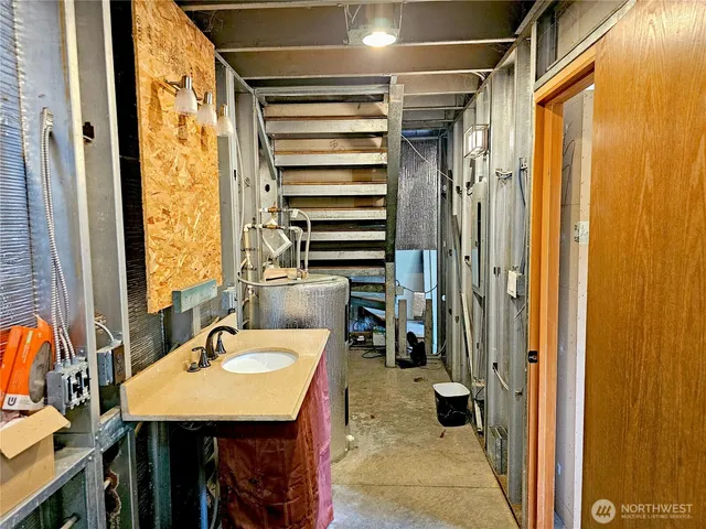 a bathroom with a sink a mirror and a shower