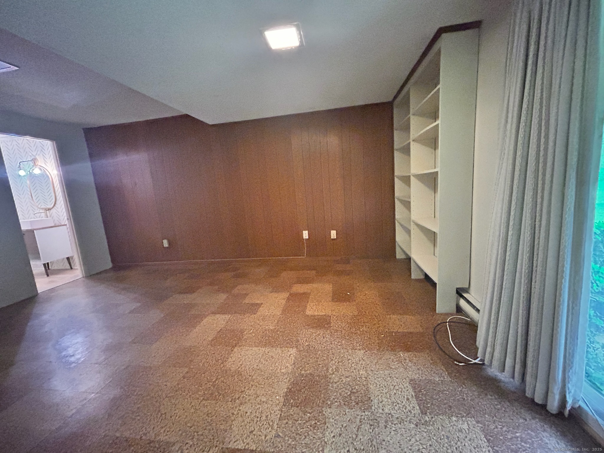 213 Baxter Road, Unit B Storrs Mansfield, CT 06268 - Photo 11 of 12 an empty room with a fireplace and painted walls