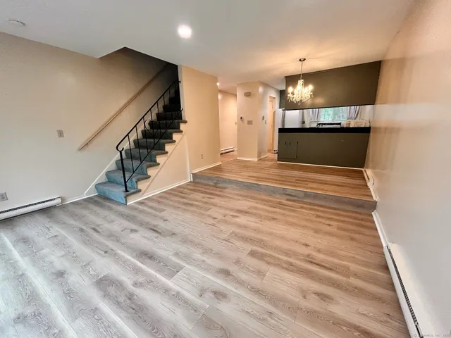 a view of a hallway with stairs